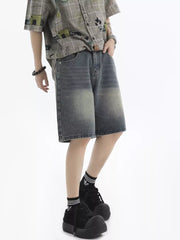 Men's relaxed fit denim shorts in vintage wash blue with faded details.