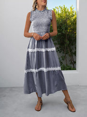 Navy blue striped midi dress with smocked bodice and lace trim.