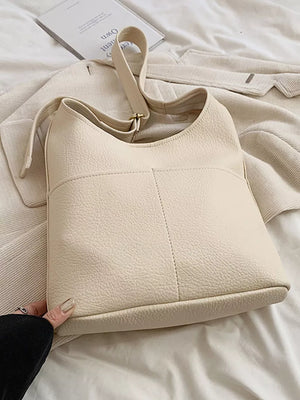 Creamy-white textured pu leather shoulder bag with adjustable strap