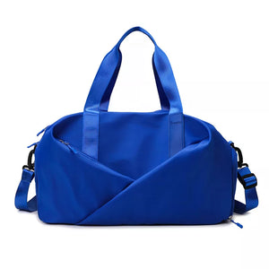 Blue nylon travel bag with adjustable strap and dual handles