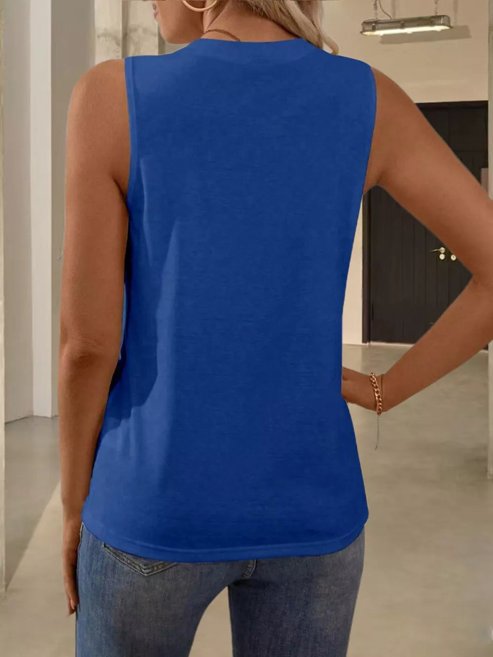Royal blue sleeveless tank top with textured pleats, a classic basic style for women.