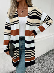 Bold stripe knit duster cardigan with black, white, beige, and burnt orange stripes.