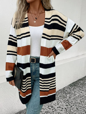 Bold stripe knit duster cardigan with black, white, beige, and burnt orange stripes.