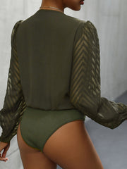 Matcha green bodysuit with sheer chevron patterned long sleeves and ribbed bottom.