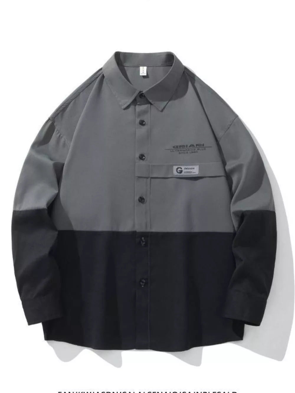 Oversized casual button-down shirt in color-block grey and black with chest pocket detail.