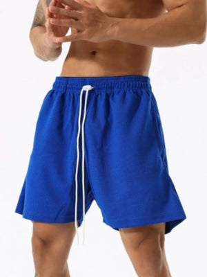 Royal blue athletic drawstring lounge shorts with white ties.