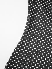 Black polka dot crop top and skirt set with ruffled detail