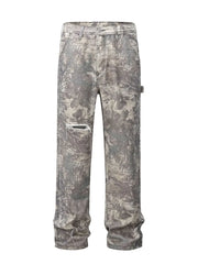 Distressed camo carpenter jeans in gray with a ripped knee detail.