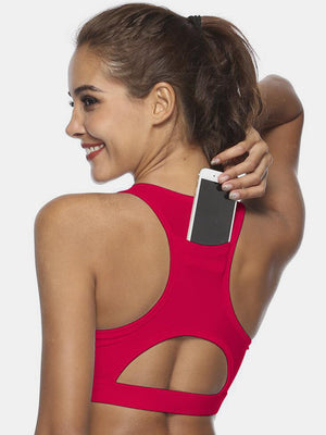Deep Red racerback sports bra with back pocket holding a phone and a cutout detail.