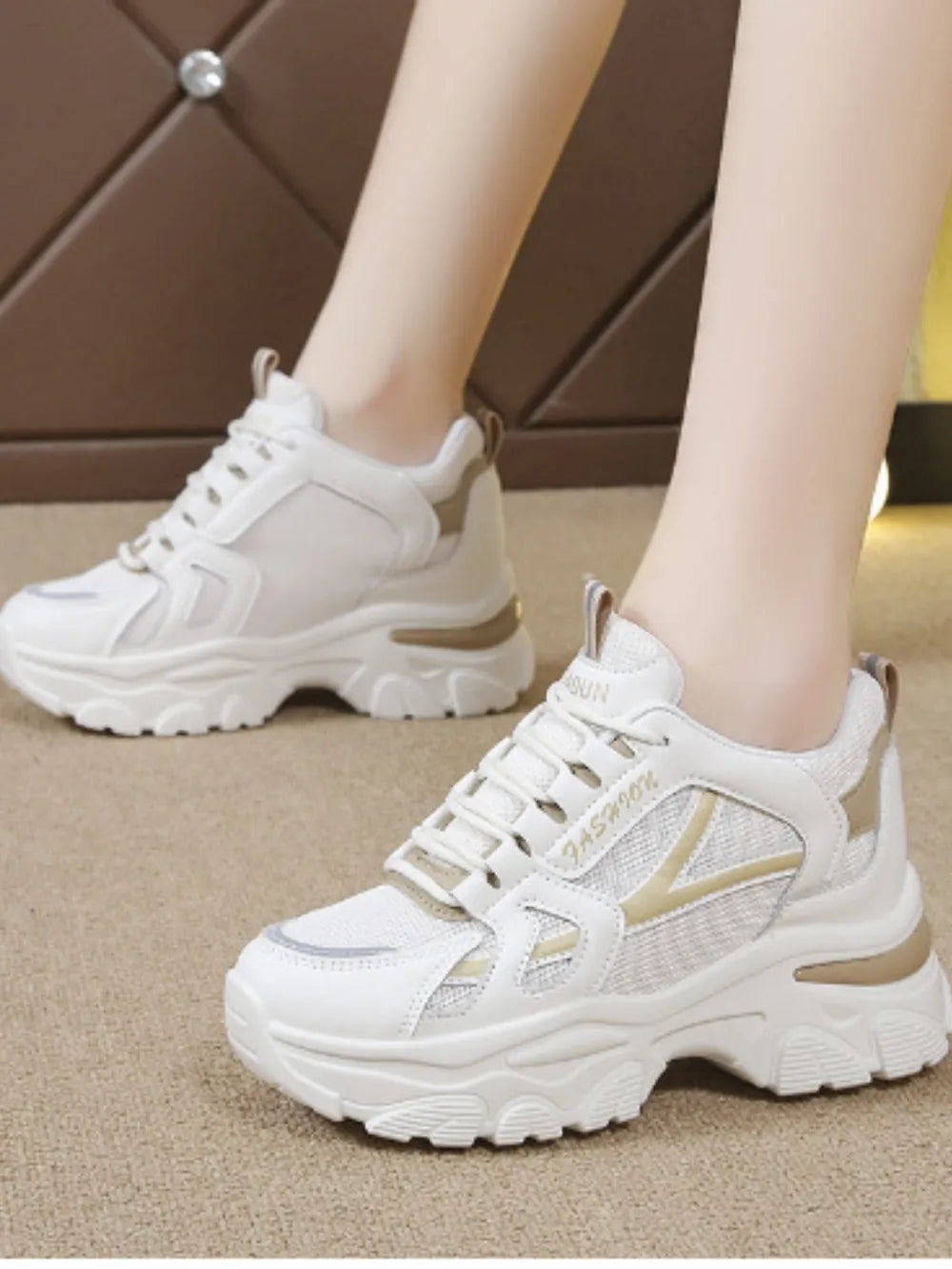 White textured mesh and leather chunky sneakers with beige accents and a thick sole.