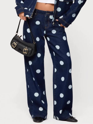 Polka dot wide leg denim maternity jeans in dark blue with white polka dots.