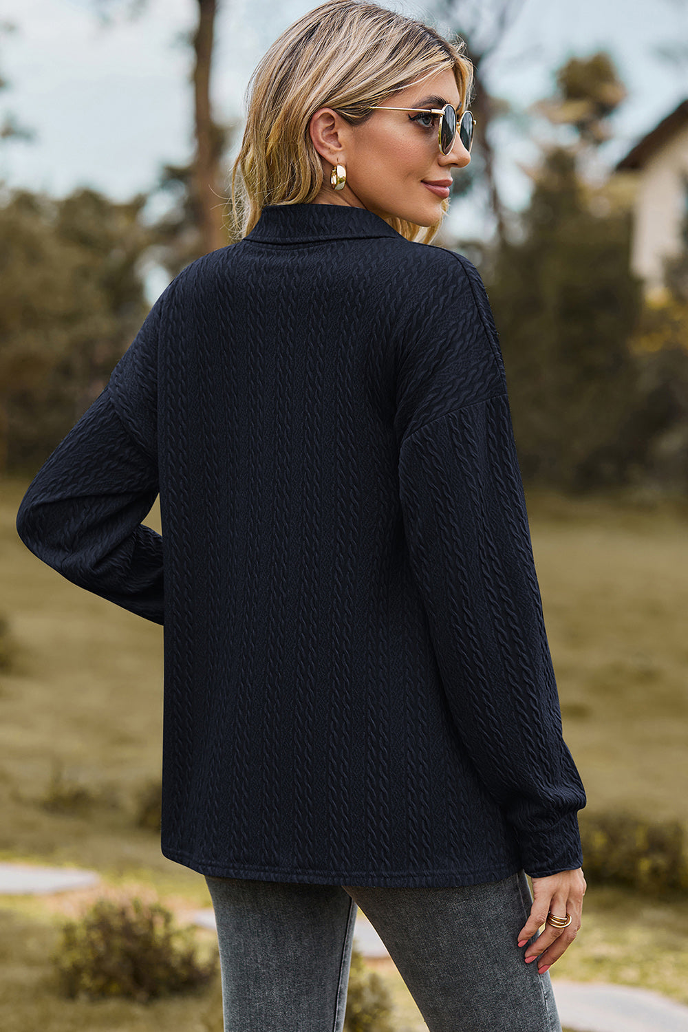 Textured polo-neck sweater in dark blue with button detail and long sleeves.