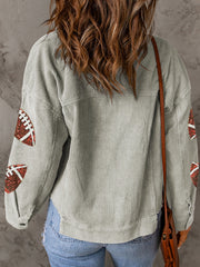 Sage corduroy overshirt with football sequin embellishments on the sleeves.