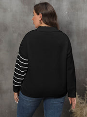 Black knit sweater with white stripe detail on sleeves and collar