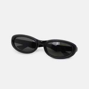 Black cat eye sunglasses with a thick, glossy frame and dark lenses.
