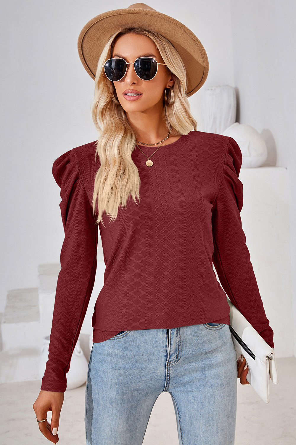 Burgundy textured puff-sleeve crew neck top with all-over diamond pattern.