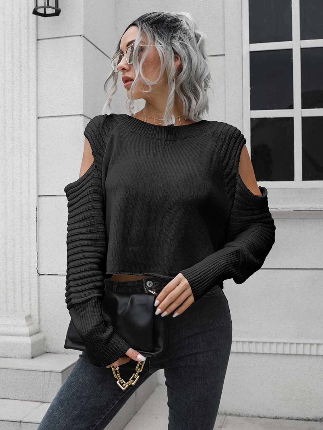 Black cold shoulder ribbed knit sweater with long sleeves and crew neck