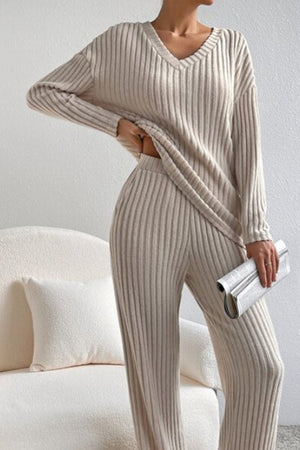 Ribbed knit loungewear set in tan with V-neck sweater and wide-leg pants.
