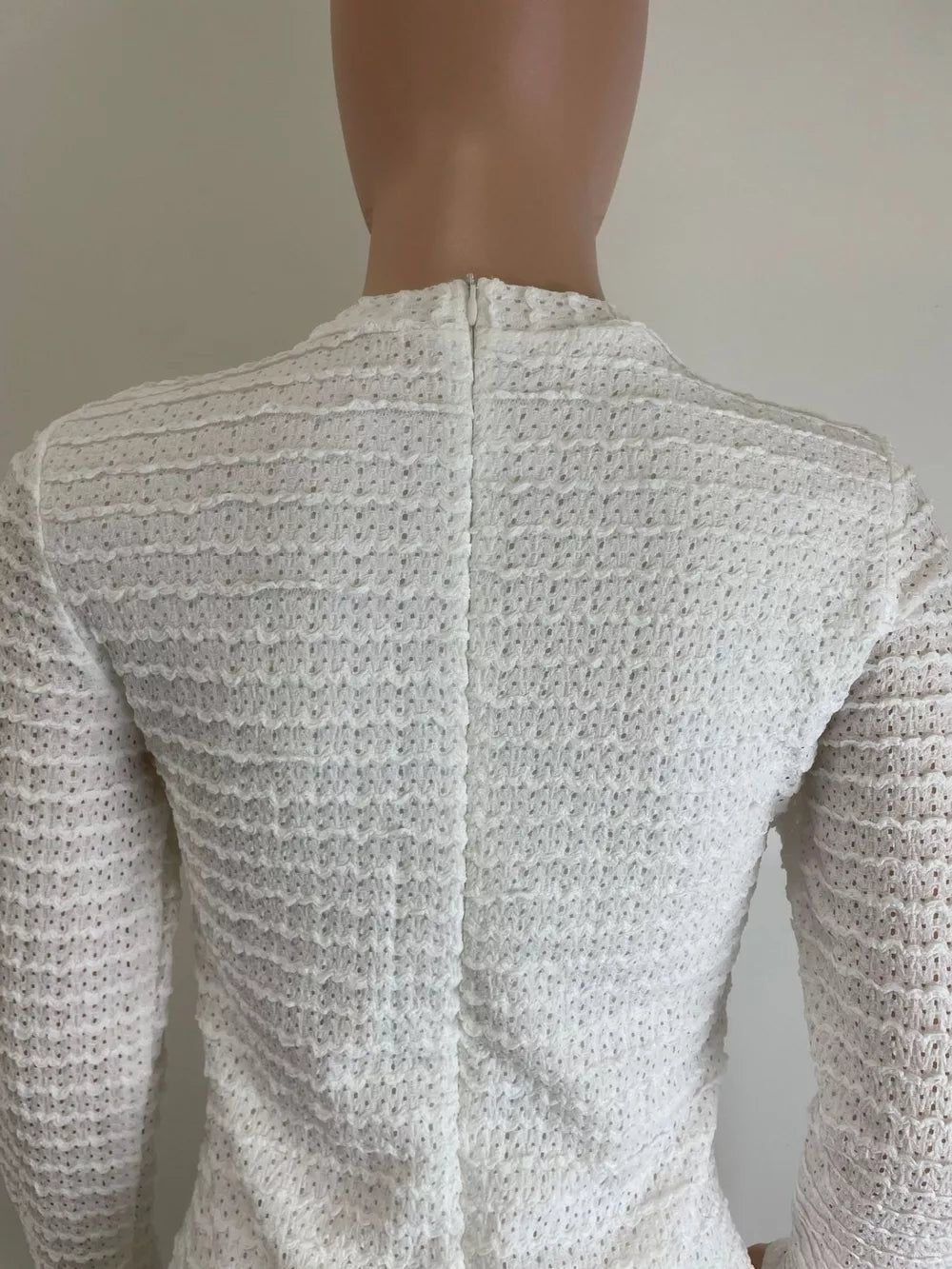 White textured midi dress with crew neck and decorative buttons, back view
