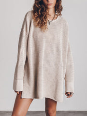 Beige oversized open-knit sweater dress with crew neck and long sleeves.