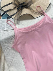 Pink scoop neck cami with spaghetti straps, part of a set.
