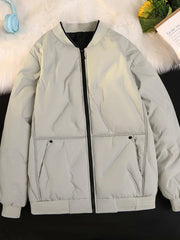 Plus-size ivory quilted bomber jacket with zip front and ribbed cuffs.