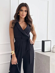 Black wrap-front wide-leg romper with belted waist and V-neck.