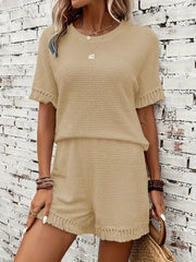 Tan textured knit short set with fringe details on sleeves and hem.