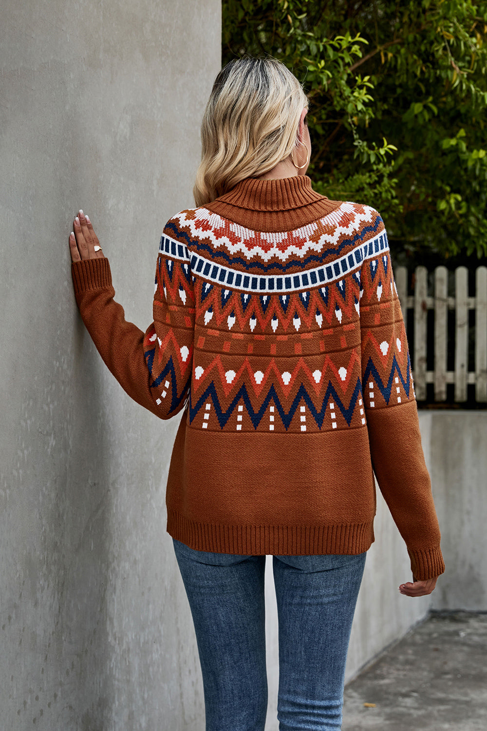 Geometric knit turtleneck sweater in caramel with fair isle pattern and ribbed cuffs.
