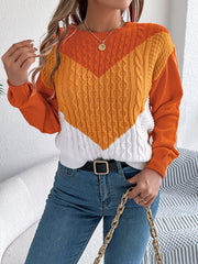 Chevron cable knit sweater with contrast orange, yellow, and white colorblock.