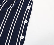 Dark blue vertical stripe palazzo trousers with white button detail