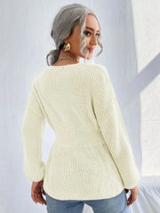 Ivory peplum knit sweater with scallop neckline and belted waist detail