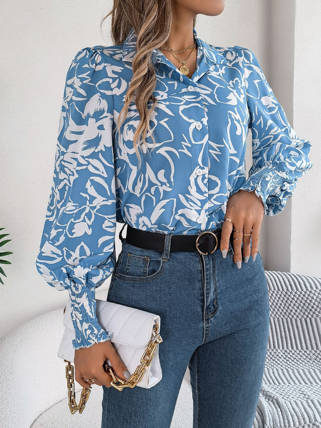 Light blue floral print blouse with shirred cuffs and button front