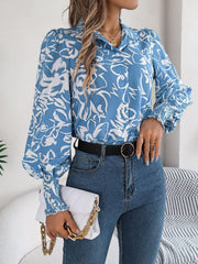 Light blue floral print blouse with shirred cuffs and button front