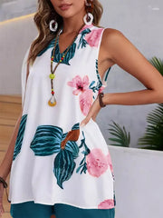 White floral v-neck sleeveless top with teal shorts.