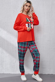 Red long sleeve top with "All Is Bright" graphic and plaid lounge pants.