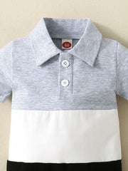 Color block polo collar baby one-piece in light gray and white cotton with button placket.