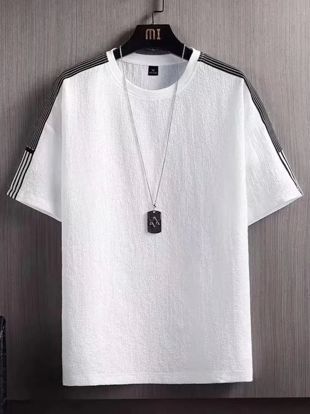 White textured t-shirt for men with black stripe detail on sleeves and neckline.