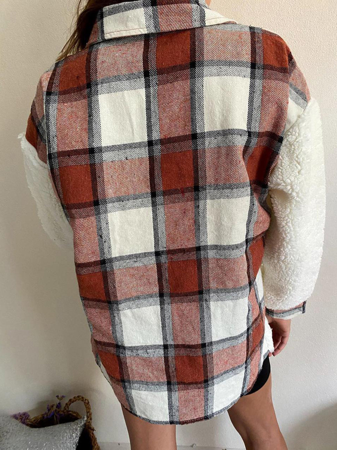 Plaid shacket with sherpa sleeves in brown and cream plaid.