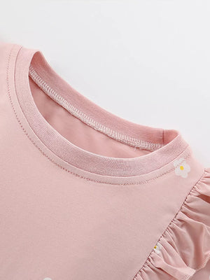 Pink cotton baby dress with ruffle sleeves and floral applique detail.