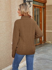 Cable knit turtleneck sweater in caramel acrylic with allover cable detail.
