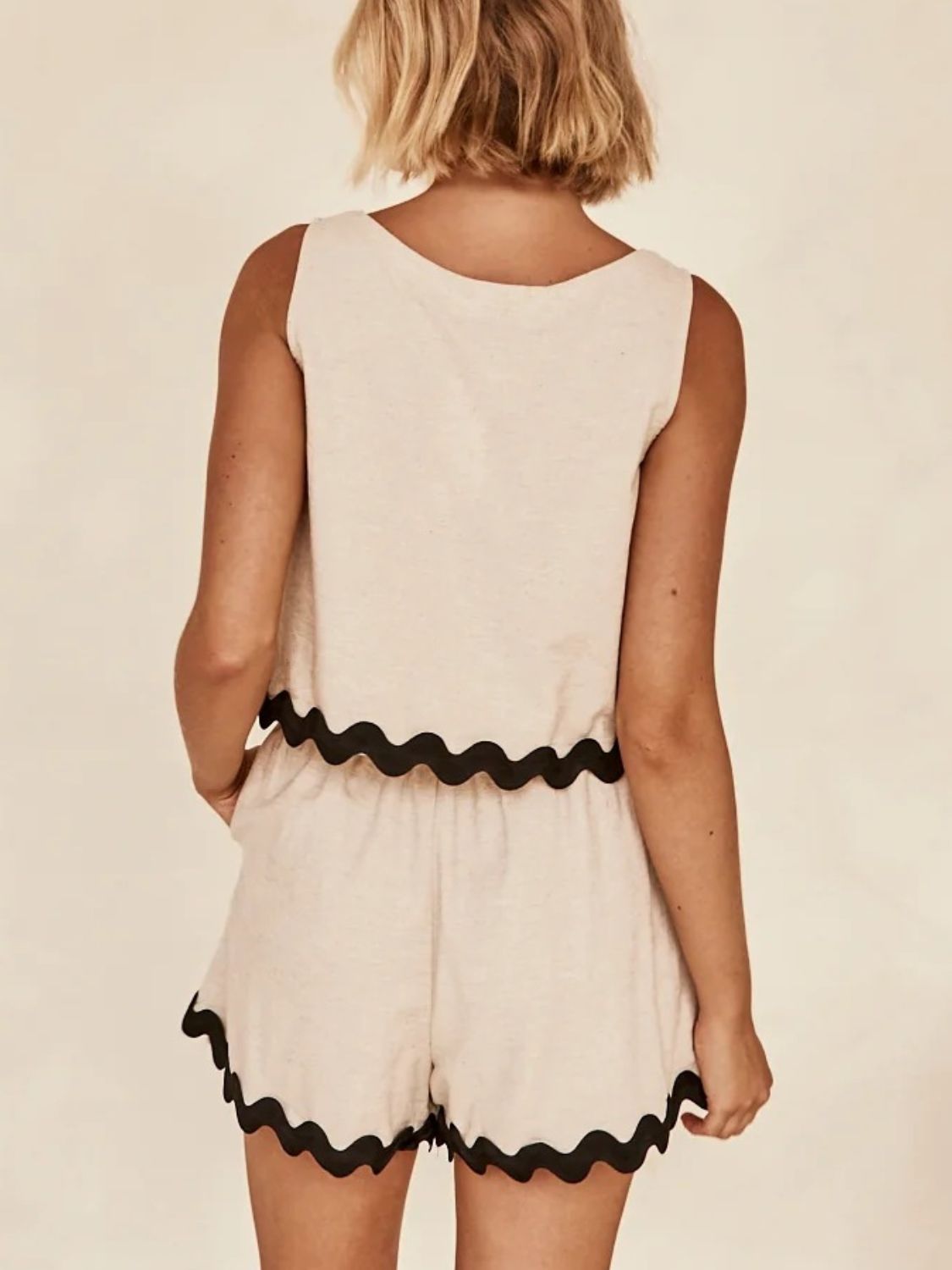 Tan linen tank top and shorts set with black scalloped trim detail.