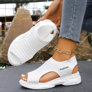 White sporty chunky platform sandals with breathable knit fabric and a "Fashion" label.