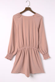 Dusty Pink tie-front blouson sleeve playsuit with smocked cuffs and waist.