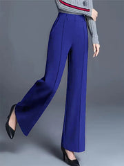 Blue high-waisted wide leg cotton trousers with pockets and front seam detail.