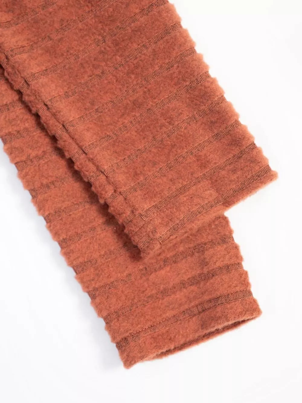 Ribbed knit A-line dress with long sleeves in rust, featuring horizontal textured stripes.