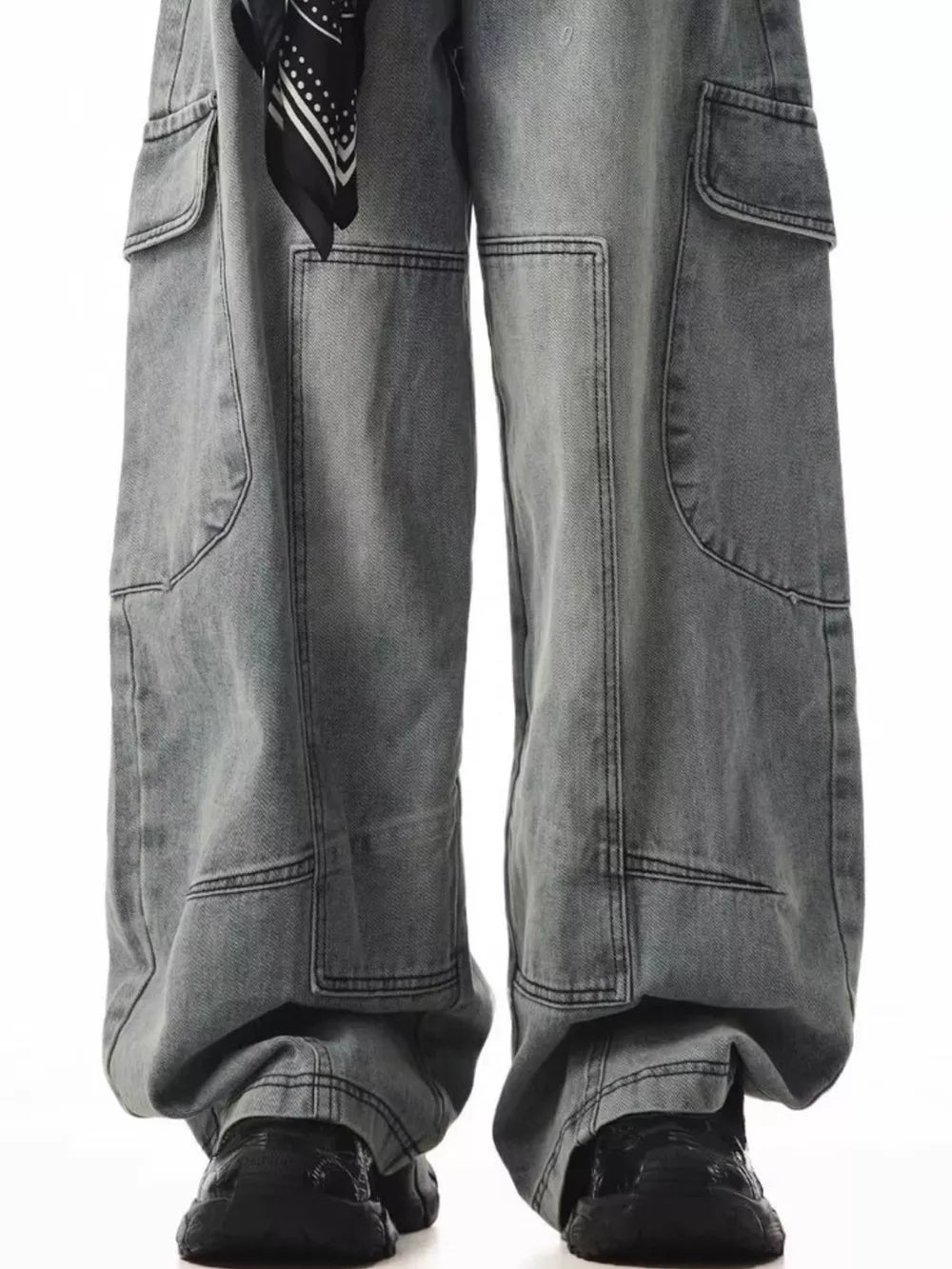 Relaxed fit grey cargo jeans with spacious pockets and a black bandana detail.