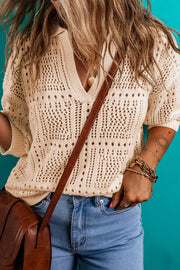 Open-knit Johnny collar pullover sweater in tan acrylic with a V-neck and short sleeves.