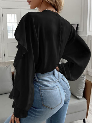 Black Flutter Chic V-Neck Blouse with ruffled sleeves and long sleeves.