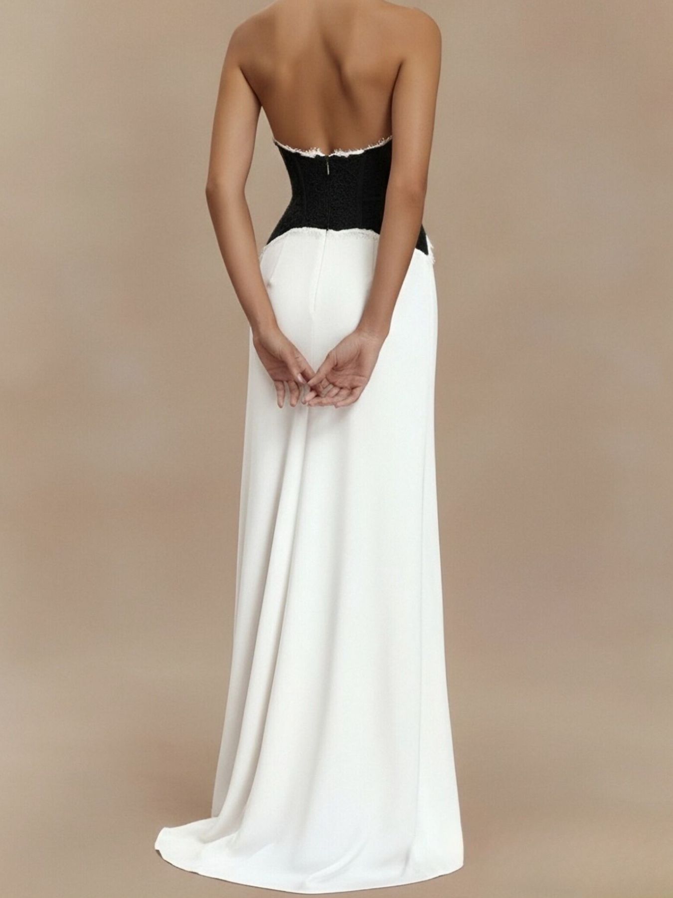 Black and white lace trim halter neck maxi dress with a flowing skirt.